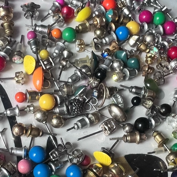 Bag full of different colored stud earrings. - Picture 10 of 13